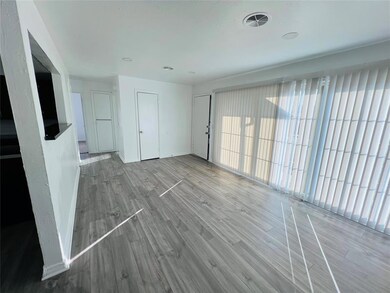 Unfurnished living room with wood-type flooring