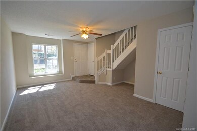 1st floor living room with new carpet and freshly 