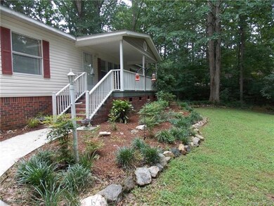 Covered porch and concrete walkway.