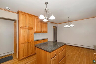 Kitchen featuring light wood-type flooring, a nota