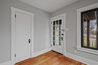 Freshly refinished hardwood floors and a new coat