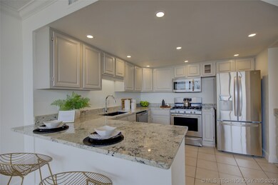 Renevoated Kitchen with new paint, countertops and Fridge.