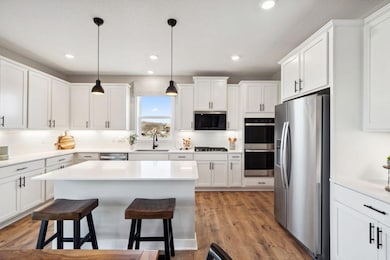 This home will have our popular Signature kitchen and is thoughtfully-designed with a combination of functionality and modern design, this kitchen space is sure to impress. Photo is of previously built model home, finishes, selections will vary.