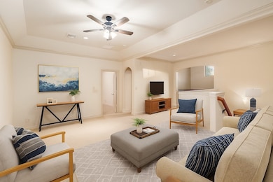 Upstairs, you'll find a large space for a game room, loft, or an office. This photo has been digitally staged.