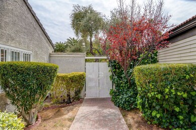Courtyard Entry with Double Iron Gates and Brick W