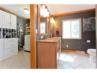 Master Bathroom & Laundry/Clothes Storage Area