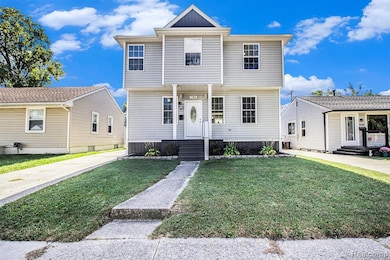 View of front of property featuring a front lawn