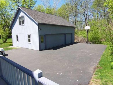 Exterior Back. 3 CAR GARAGE WITH HEATED SECOND FLO
