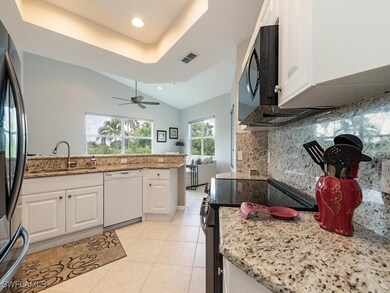 Kitchen with stainless steel appliances, light sto