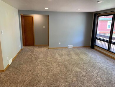 Large picture window looks out to deck.  Hallway l
