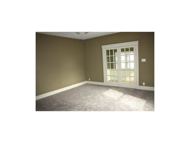 Living room with French doors into sun room