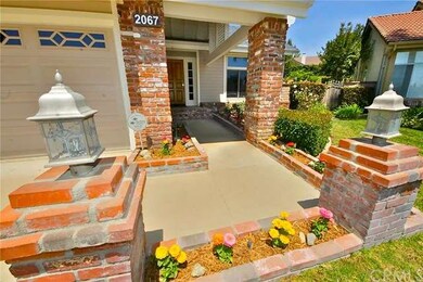 Manicured grounds with custom brickwork and outdoo