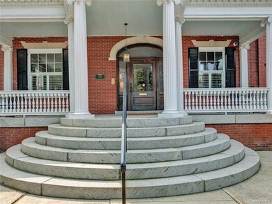Gracious granite steps leading to portico and front entrance.
