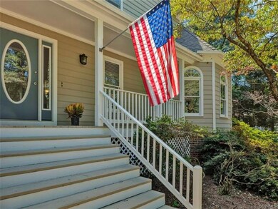 Grand stairs leading onto peaceful front porch.