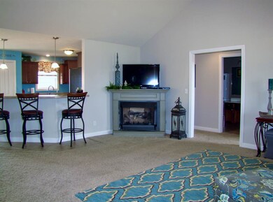 Great room with cathedral ceiling opens to the din