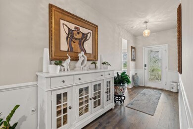 Entrance foyer featuring dark hardwood / wood-styl