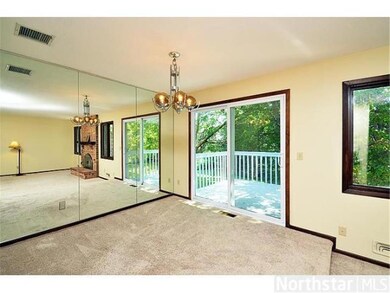 Formal Dining Room features wall of mirrors to tra