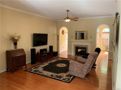 Family Room with Gas Fireplace and Crown Moulding.