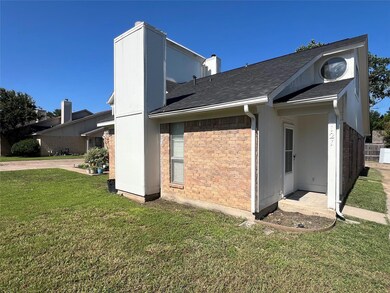 Side view of house featuring a lawn