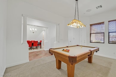 Recreation room featuring light colored carpet, a
