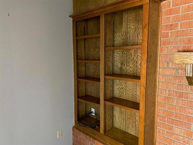 bookshelves by fireplace