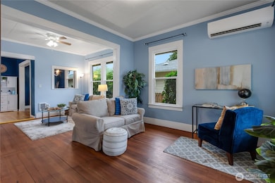 High ceilings and original floors greet you when you open the front door. A ductless mini-split provides heat and AC. Many energy efficient upgrades were made by previous owner, including insulation and newer windows!