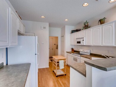 Kitchen with laundry room off of it