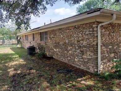 View of property exterior with central AC