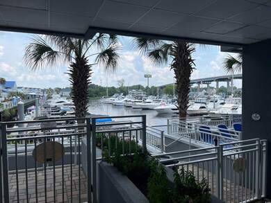 Balcony with view of marina and a water view