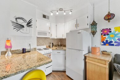 Freshly painted cabinets.  2 year old refrigerator
