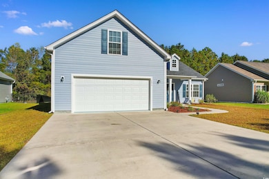 Front facade with a front yard and a garage