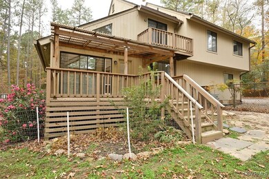 Back of property featuring a balcony