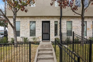 Entrance to property with stone siding and stucco siding