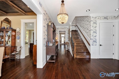 Wood flooring, recessed lighting, wainscotting, crown molding