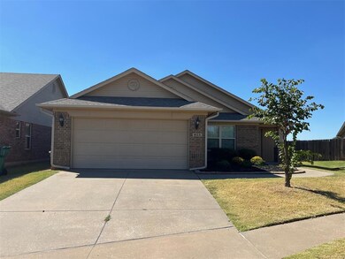 Single story home featuring a garage and a front l