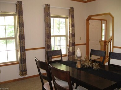 Dining room looking toward foyer.  Crown moldings