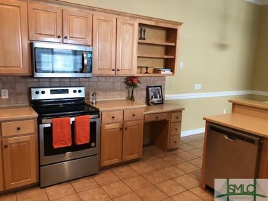 Large kitchen has new stainless appliances all und