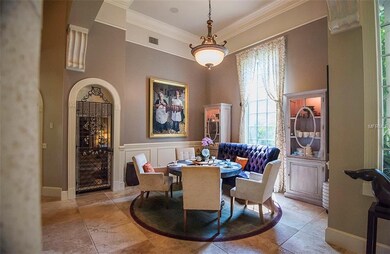 The formal dining room features custom millwork an