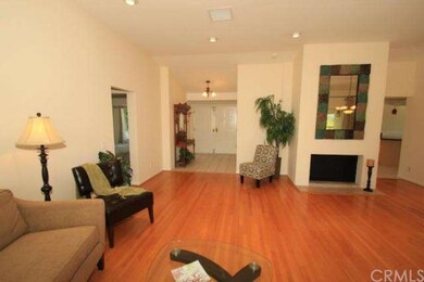 Living room fireplace with tiled front entrance in