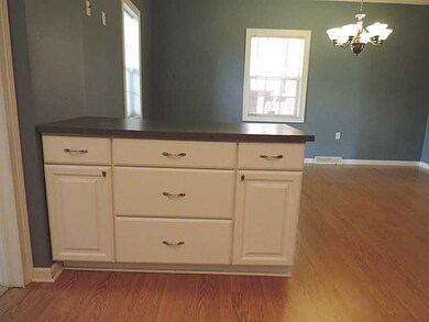 Kitchen. Open to the dining room and new laminate 
