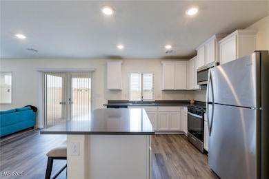 Kitchen featuring dark countertops, wood finished