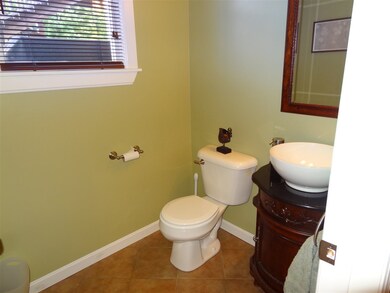 Beautiful Half Bath with tile floors, vessel sink 