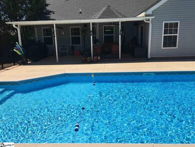Beautiful Sparkling Pool and Patio on back of home