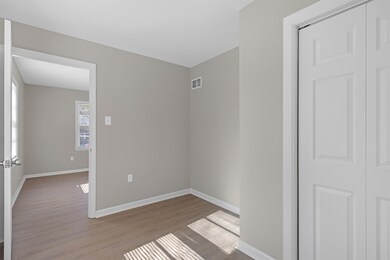 Unfurnished room with light wood-type flooring