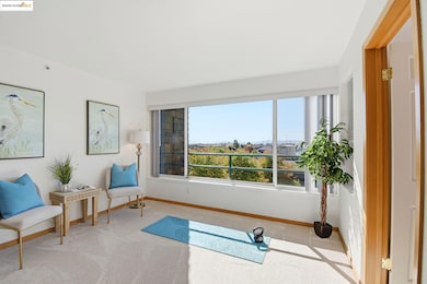 Workout area featuring carpet and baseboards
