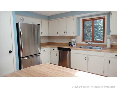Kitchen. Spacious open light kitchen with new stai