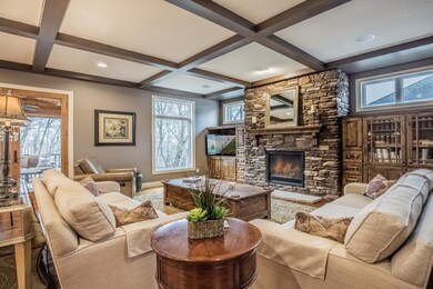 Living room highlights floor-to-ceiling stone surr