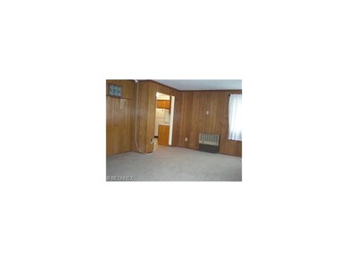 Carpeted & Paneled Family Room with Electric Heate