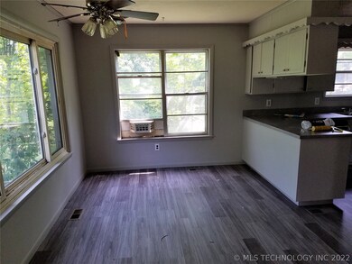 Bright dining area. New vinyl flooring and paint.