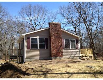 Exterior Front. sliding doors off of kitchen with